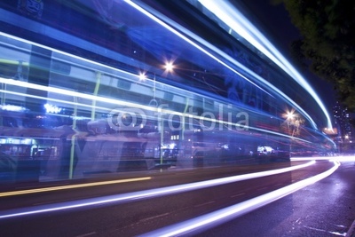 Light trails at night with busy traffic