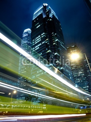Traffic in Commercial Landmark at Night