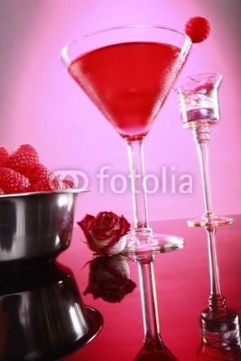 Cosmopolitan coktail and raspberry on pink
