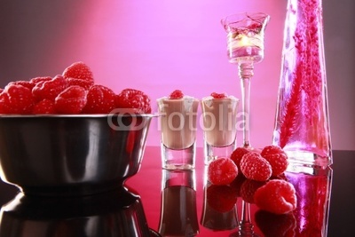 Cream liquor and raspberries in a romantic setting