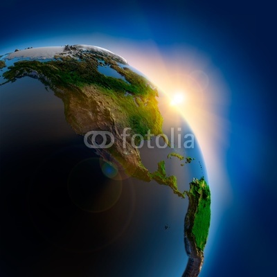 Sunrise over the Earth in outer space