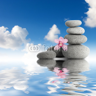 Gray zen stones and orchid sky with clouds