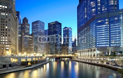 Chicago skyline along the river just after sunset
