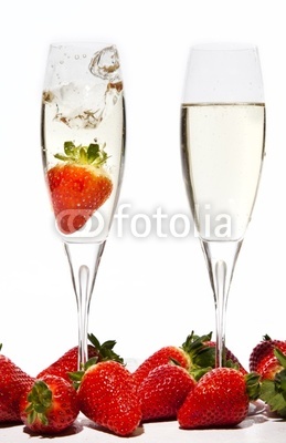 Strawberries Splashing into a glass of Champagne