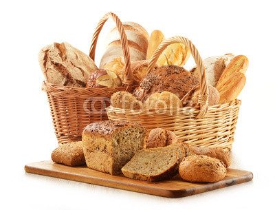 Bread and rolls in wicker baskets isolated on white