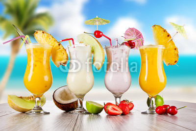 Pina colada drinks with blur beach on background
