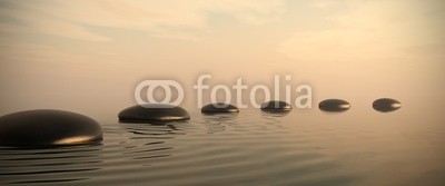 Zen path of stones on sunrise in widescreen