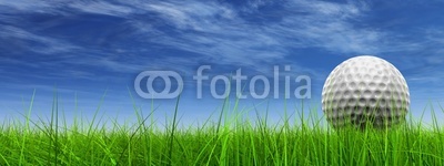 conceptual 3D golf ball on green grass over a blue sky