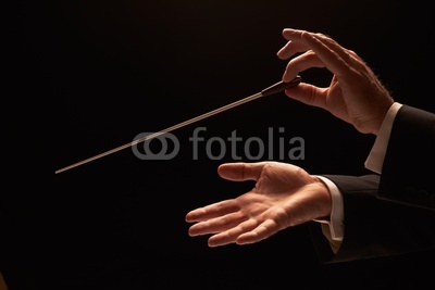 Conductor conducting an orchestra